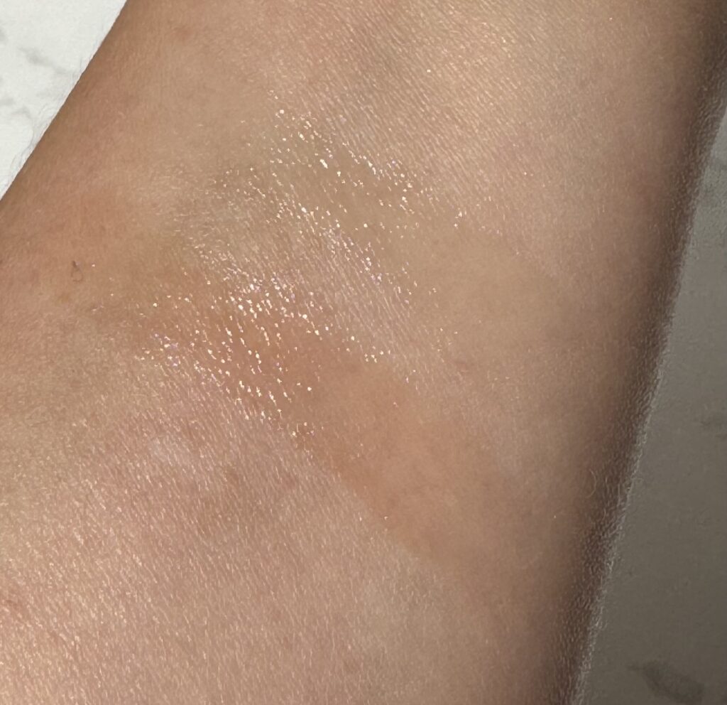 swatches of the Charlotte Tilbury Magic Lip Oil in original and rose lust