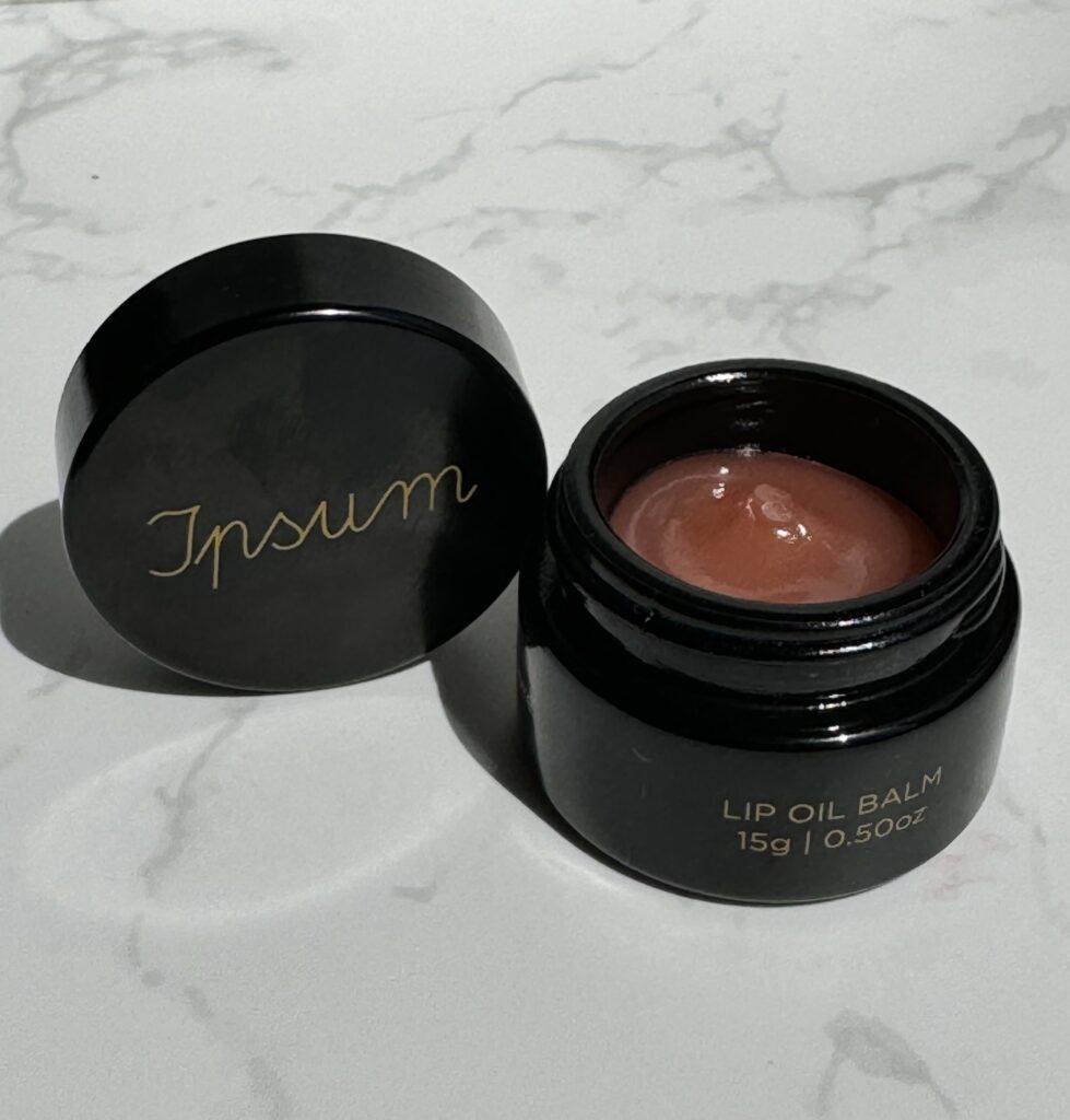 Ipsum Lip Oil pot open to reveal the texture inside