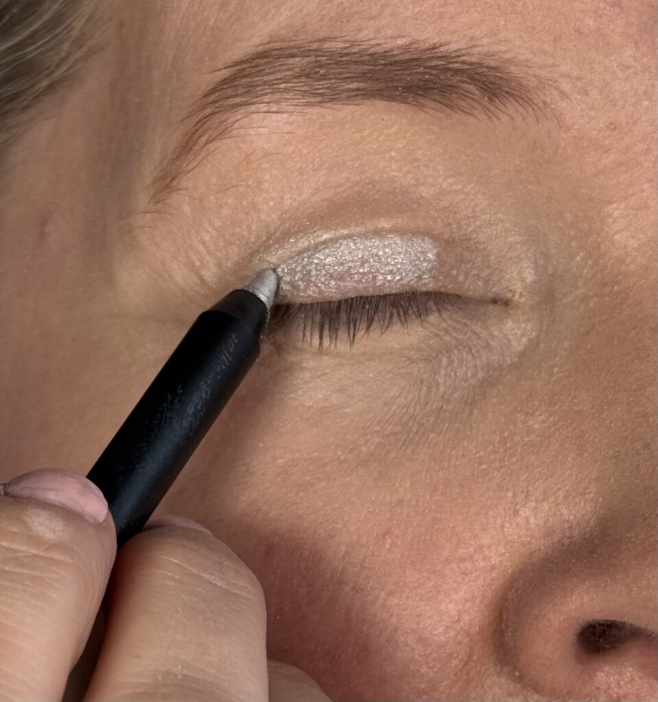 Applying the eyeliner directly to eyelid