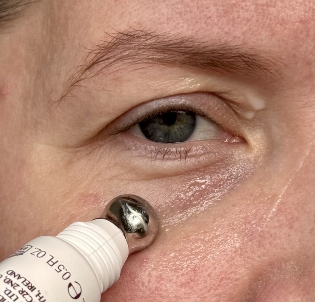 Massaging the eye serum into the under eye