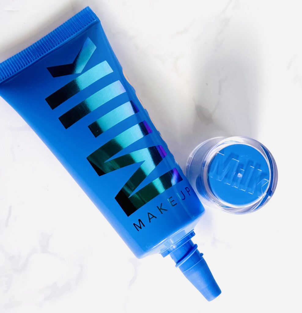 The open tube alongside lid of the tint
