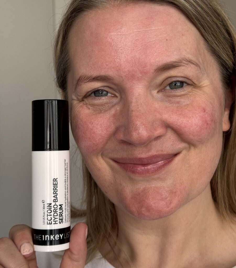 Holding the Inkey List Ectoin Hydro-Barrier Serum after applying