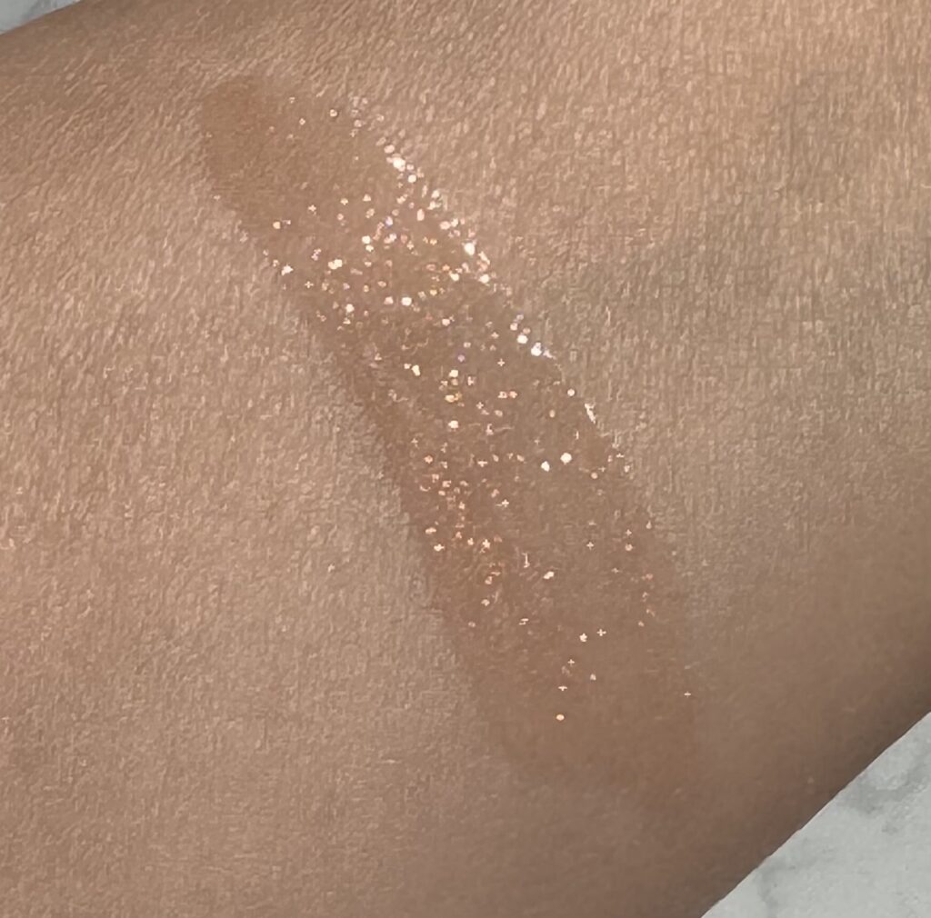 Arm swatch of Charlotte Tilbury Big Lip Plumpgasm Nudegasm Diamonds