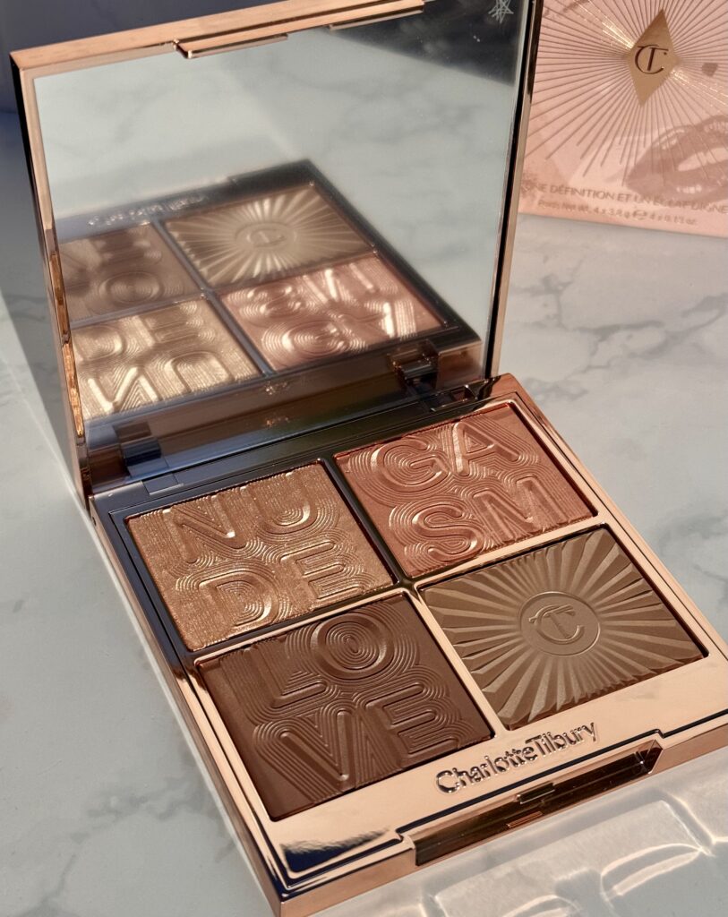 Charlotte Tilbury Nudegasm Palette open showing mirror and four shades enclosed