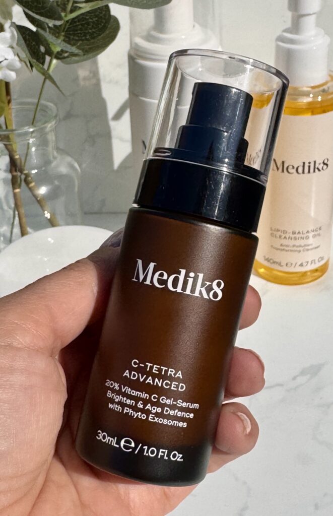 Holding the Medik8 C-Tetra Advanced in hand