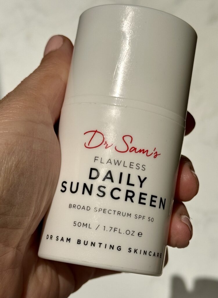 Dr Sam Bunting Flawless Daily Sunscreen held in hand