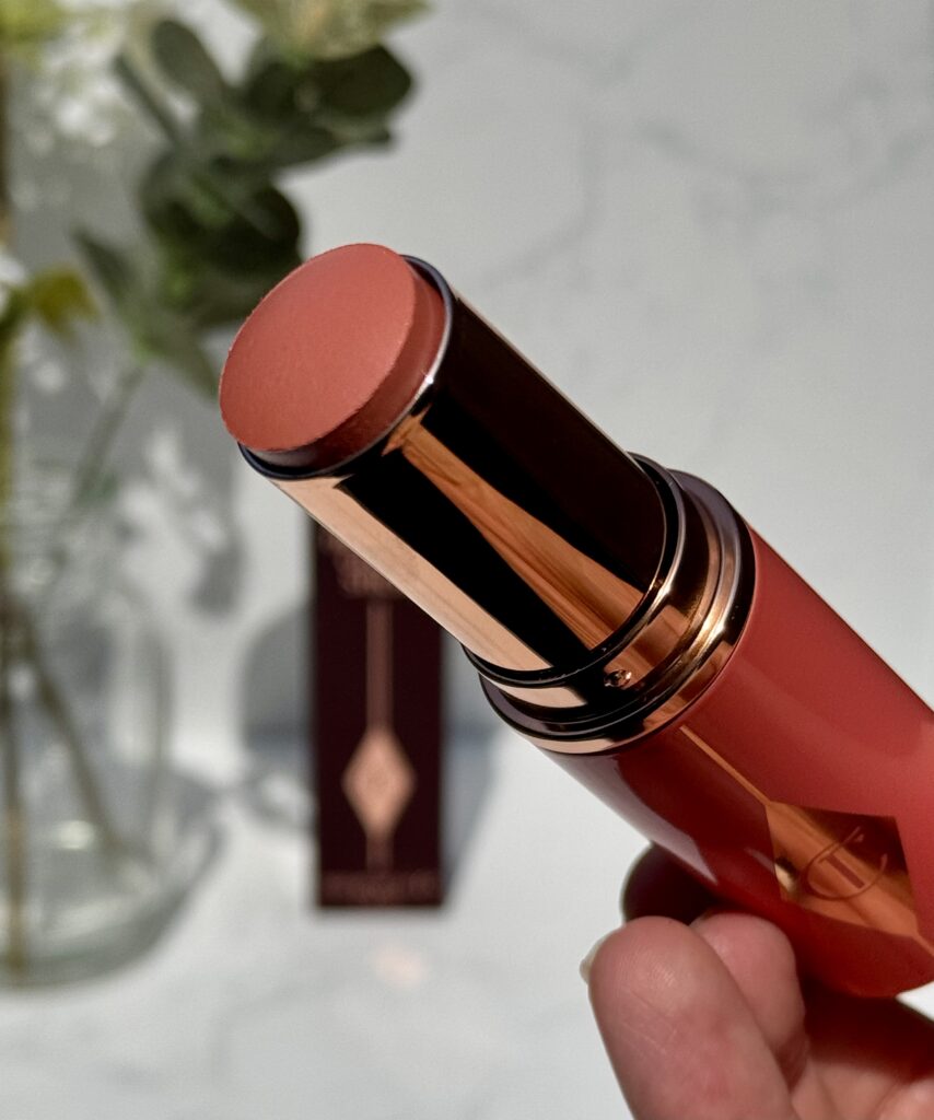 The top of Unreal Blush stick in Peachy Glow