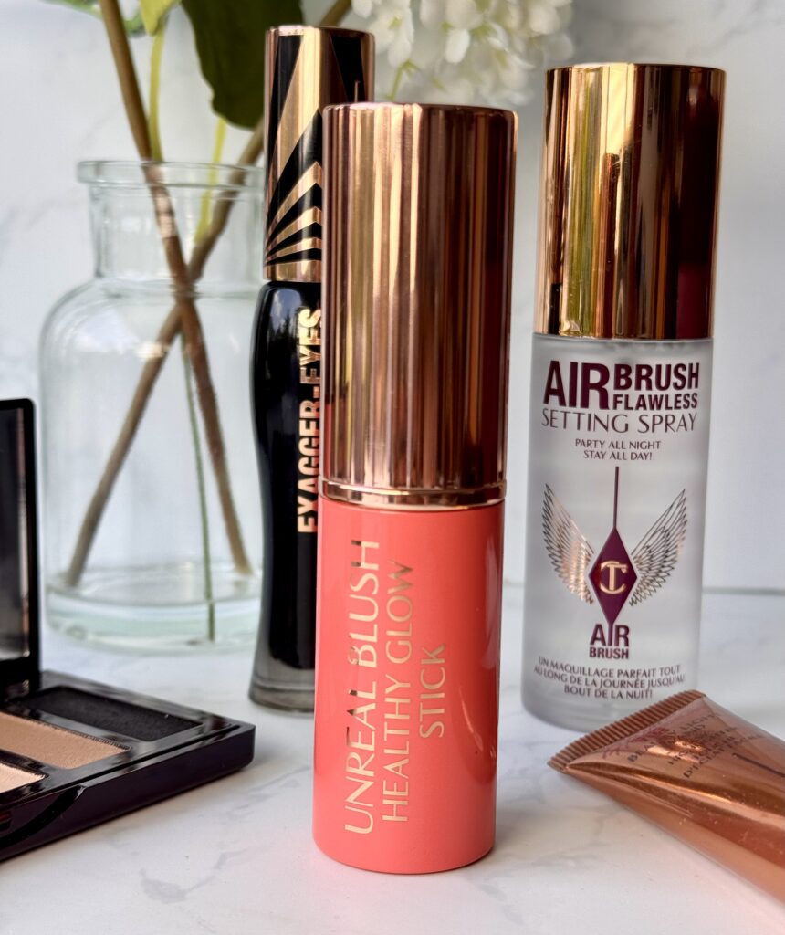 Charlotte Tilbury Unreal Blush with other beauty products