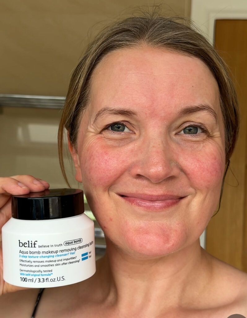 Holding Belif Aqua Bomb Cleansing Balm after use