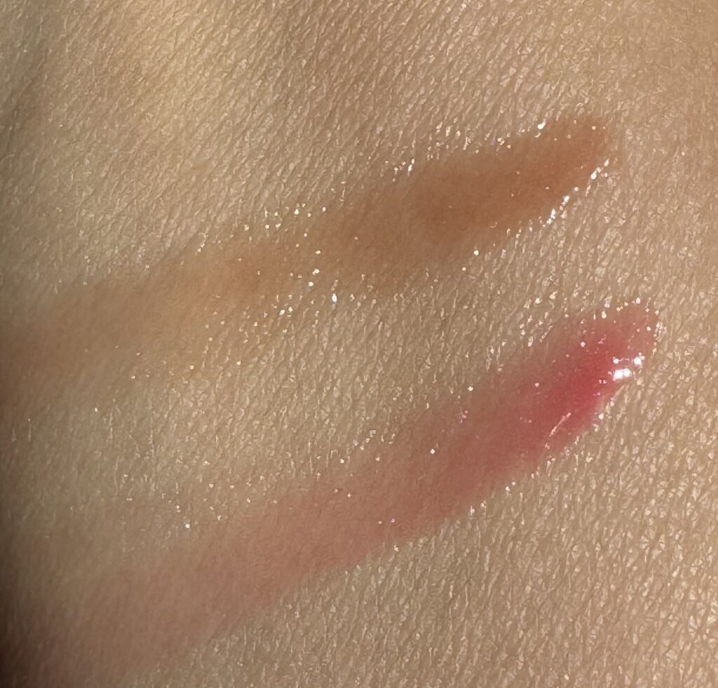Swatches of Reeson Glossing Balms on arm