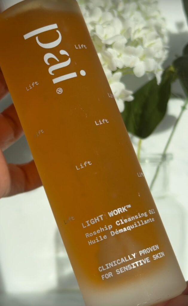 holding the Pai Lightwork Cleansing Oil in hand